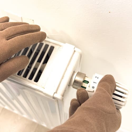 Technician servicing a heating unit