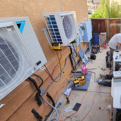 mini split AC systems against a wall