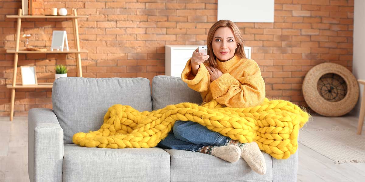 Woman under blanket